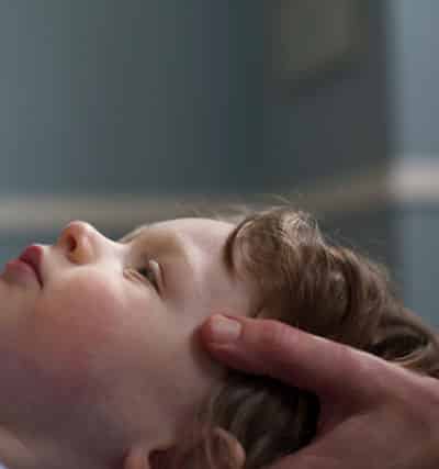 Cranial Osteopathy Child Receiving Treatment